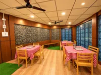 Dining area where breakfast is served at KEVINS Bed & Breakfast, Port Blair