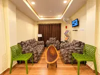 Guest lounge with sofas and TV at KEVINS Bed & Breakfast