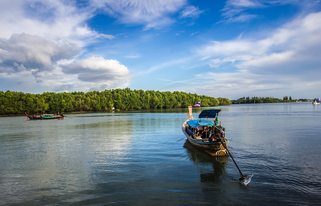 Boats on a calm river with forest, Andaman