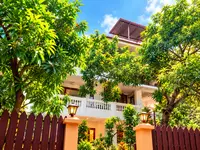 KEVINS Bed & Breakfast building among green trees in Delanipur, Port Blair